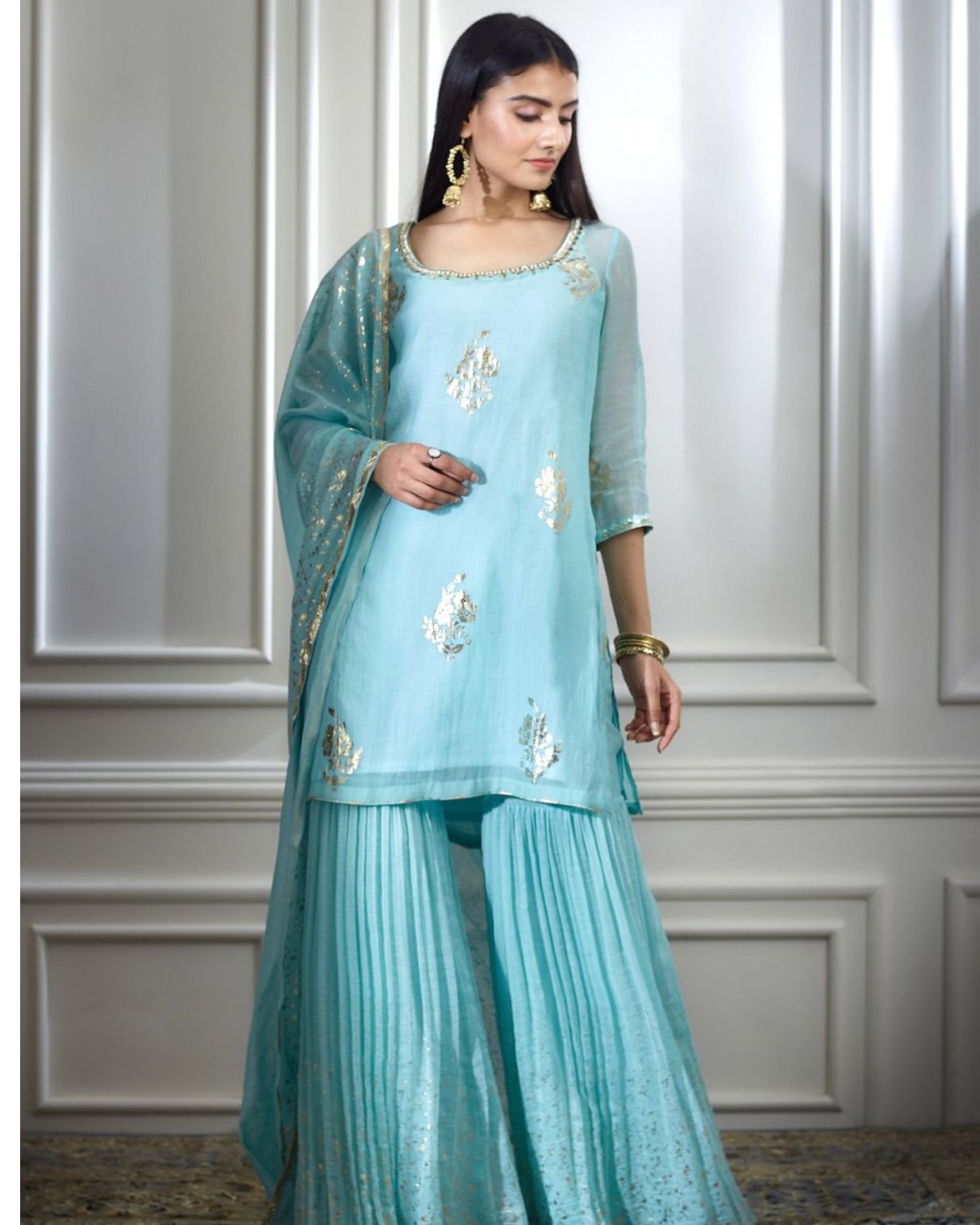 Aqua foil printed hand embroidered kurta paired with sharara and dupatta