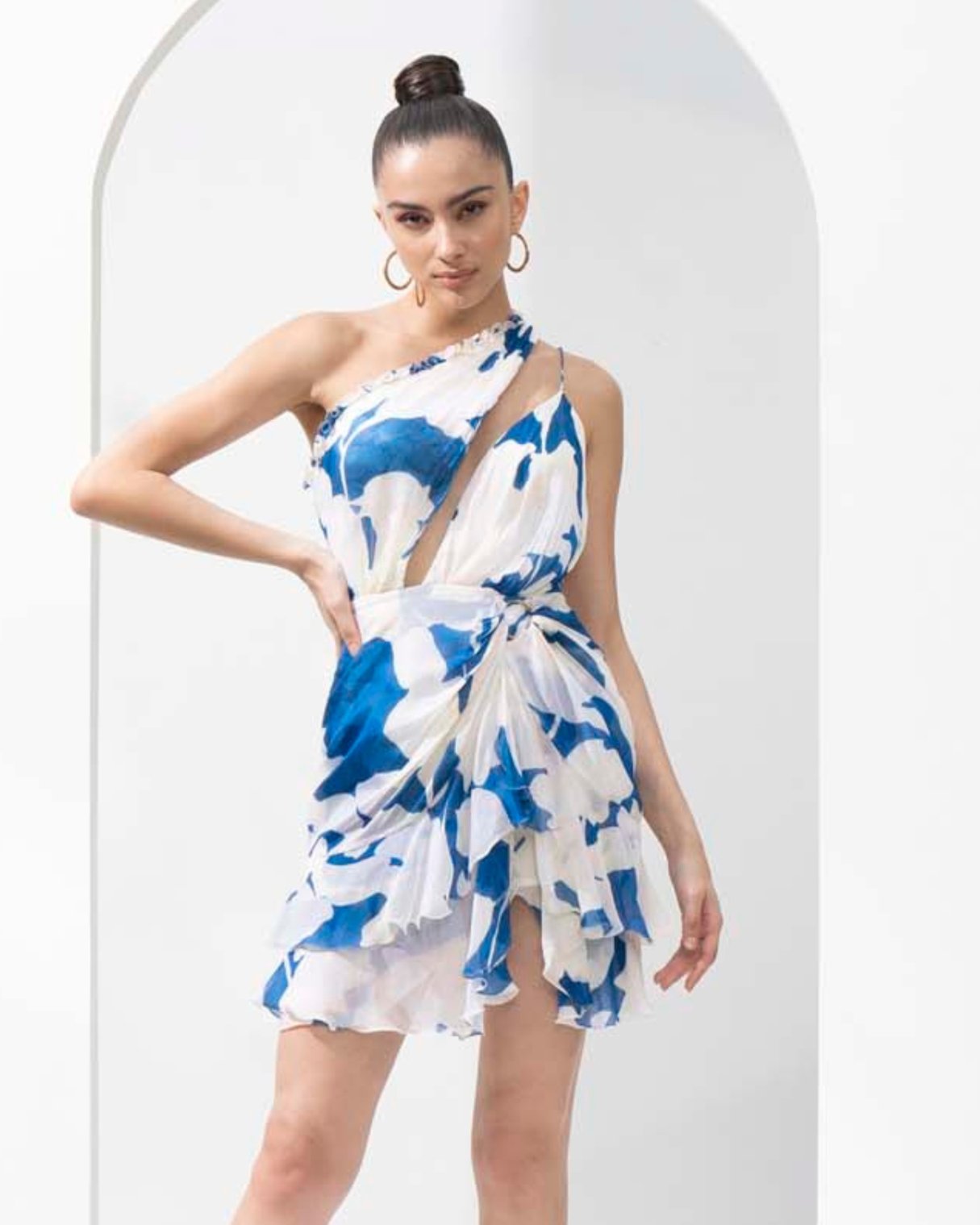 Mystic blue texture printed one-shoulder chiffon short dress with a gold accessory.