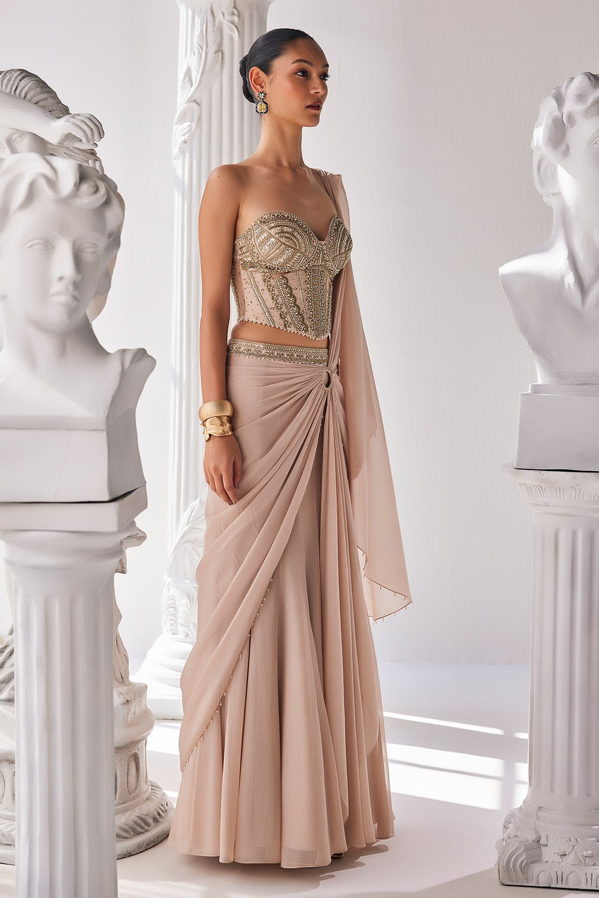 Draped Saree In Metallic Shimmer Chiffon Fabric With Intricate Embroidery Detail In The Corset Along With An Embroiderd Belt.