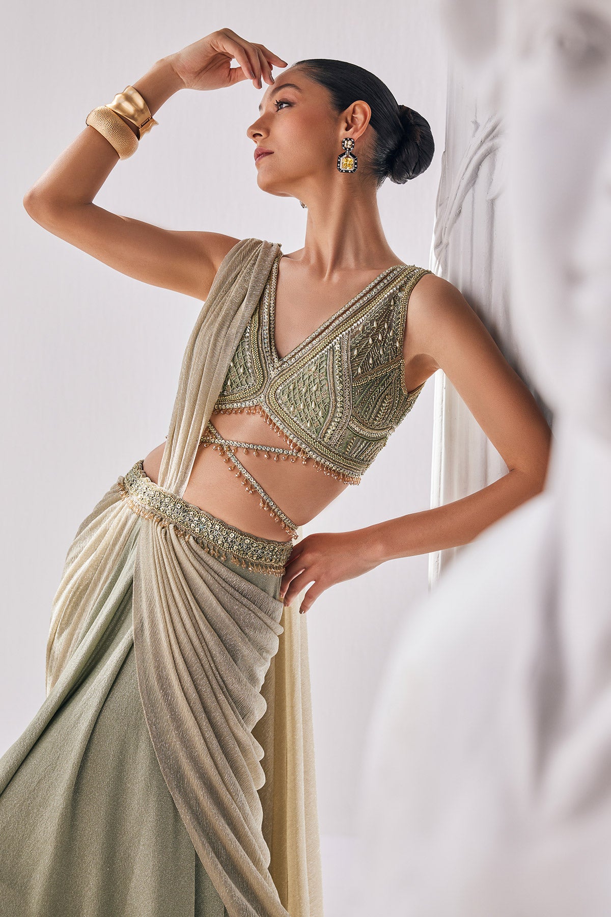 Jade Green Coloured Draped Saree In Lycra And Crinkle Fabric. It Features A Plunging Neck Blouse With Beadwork And Sequin Detailing.