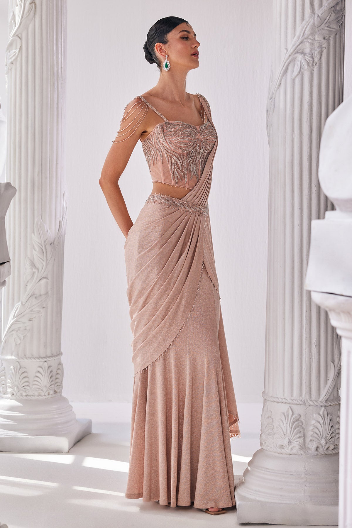 Peach Draped Saree In Luxurious Shimmer Lyrcra. It Is Paired With Anembroidered Corset Blouse And Highlighted With A Statement Belt.