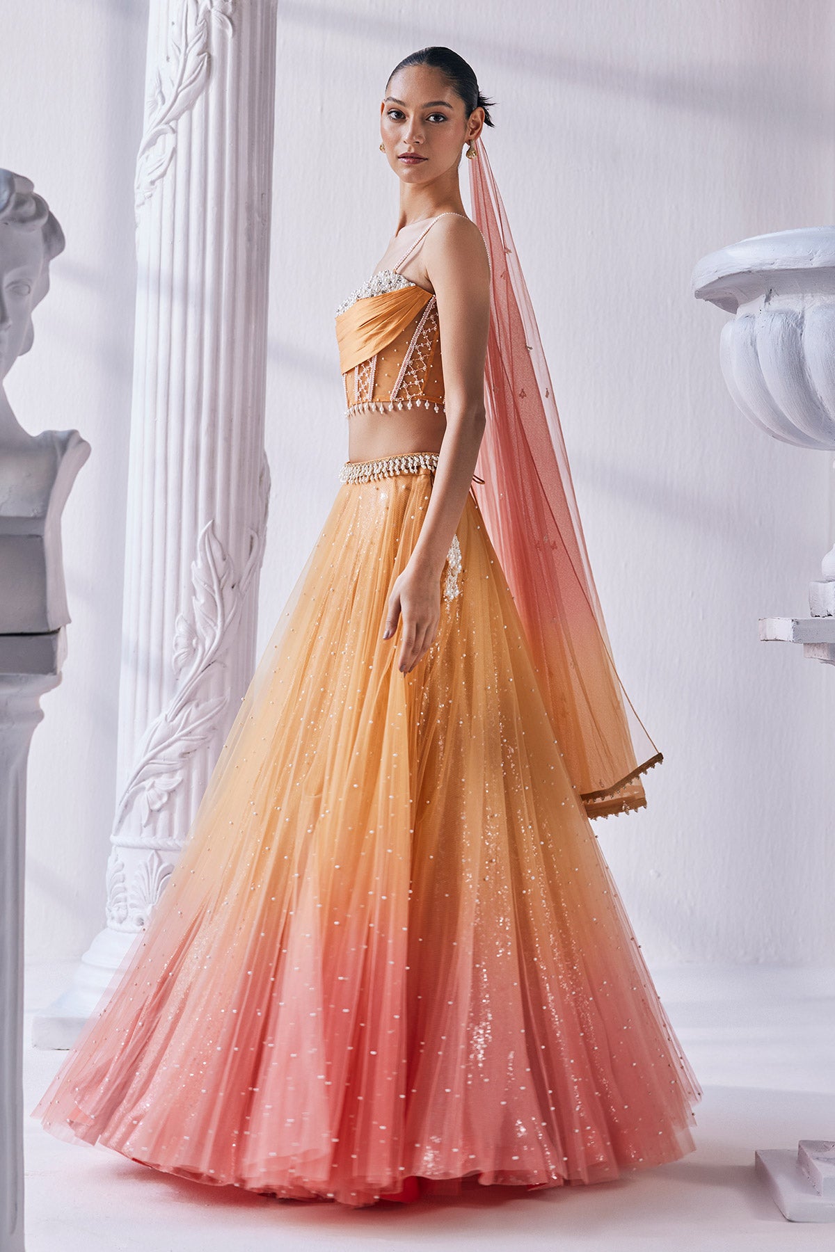 Satin Georgette Ombre Lehenga In Sequin And Pearl Detail. It Is Paired With A Bead Work Corset, Belt And A Dupatta.
