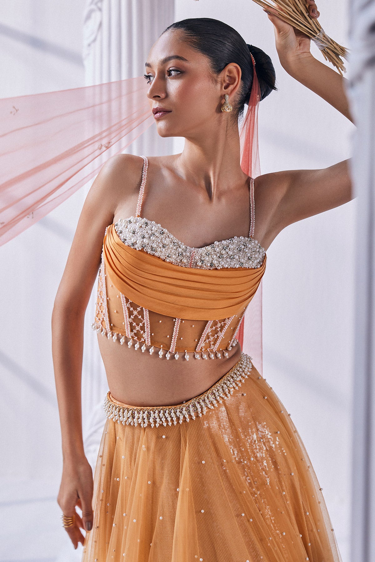 Satin Georgette Ombre Lehenga In Sequin And Pearl Detail. It Is Paired With A Bead Work Corset, Belt And A Dupatta.