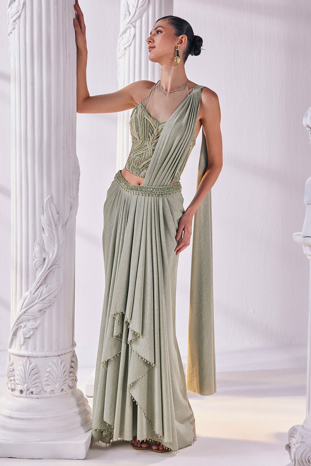 Jade Green Draped Saree In Luxurious Shimmer Lycra Paired With Anemroidered Corset And A Belt.