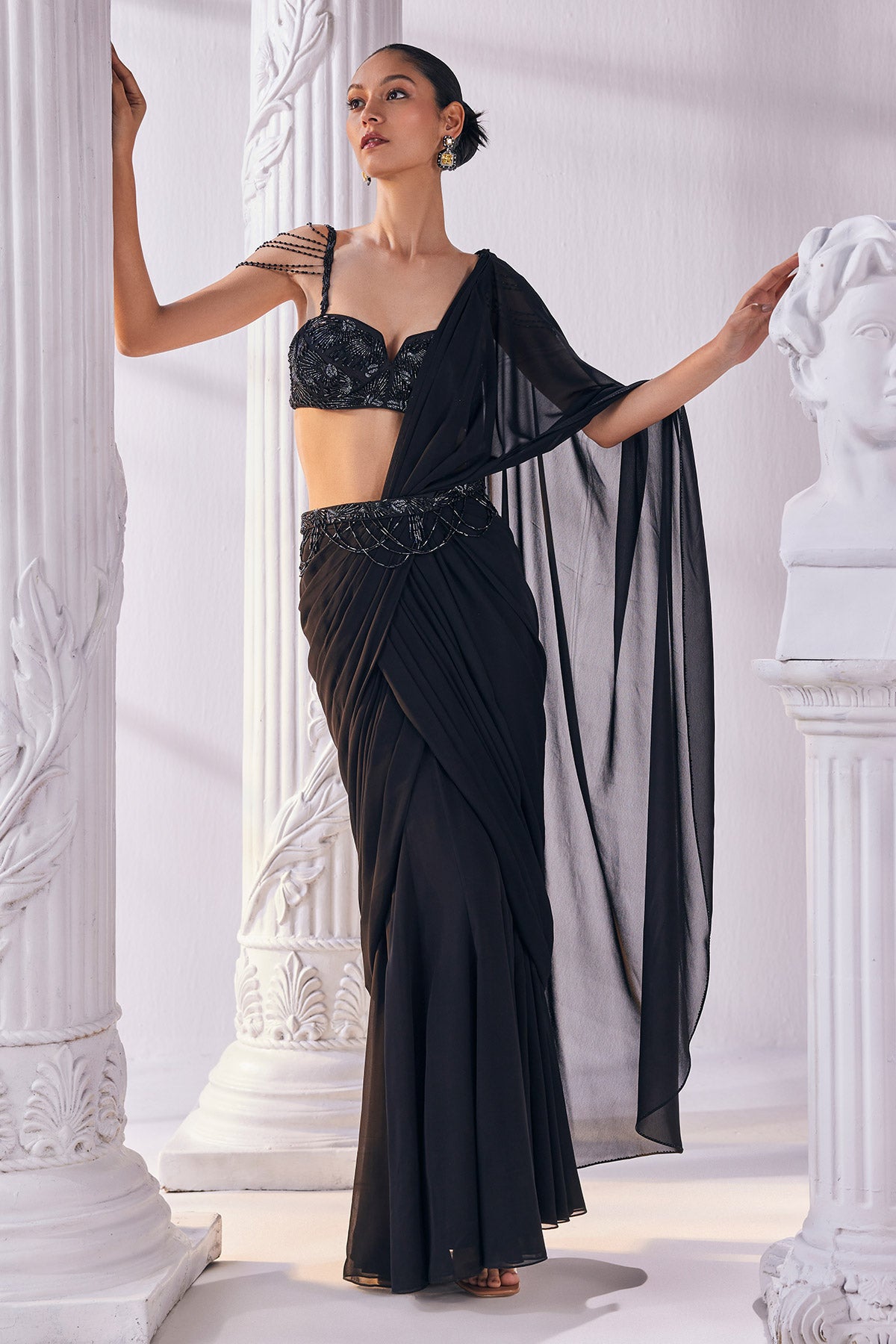 Draped Saree In Royal Georgette Fabric Designed With An Embroidered Bustier And A Statement Belt.