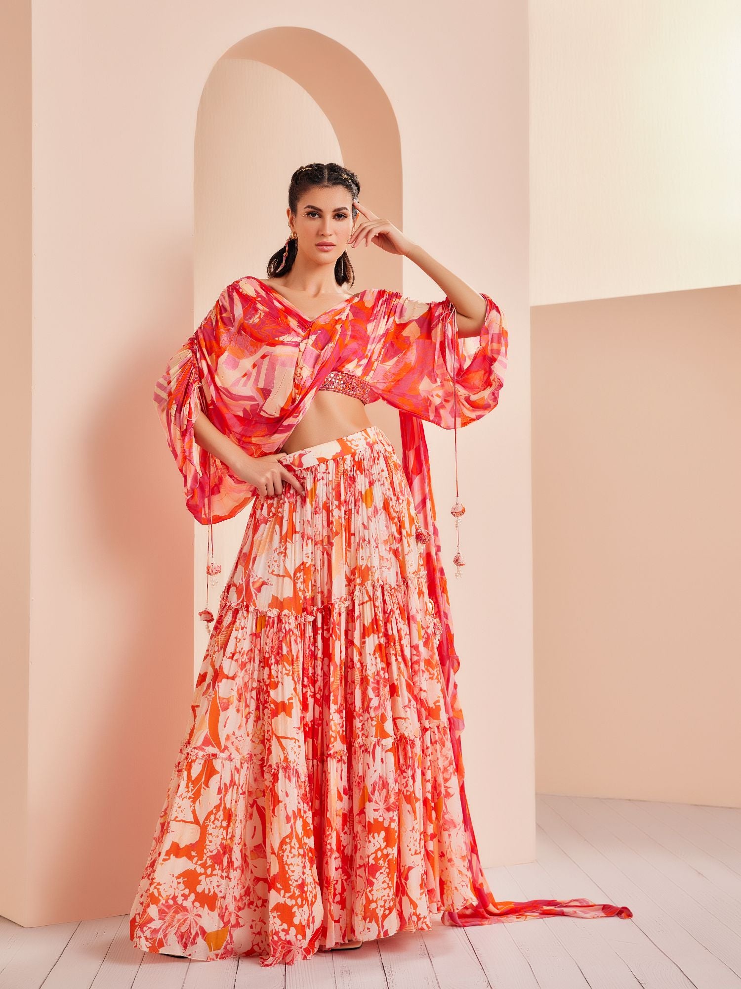 Printed chiffon tiered lehenga with stylized draped blouse detailed rushed sleeve