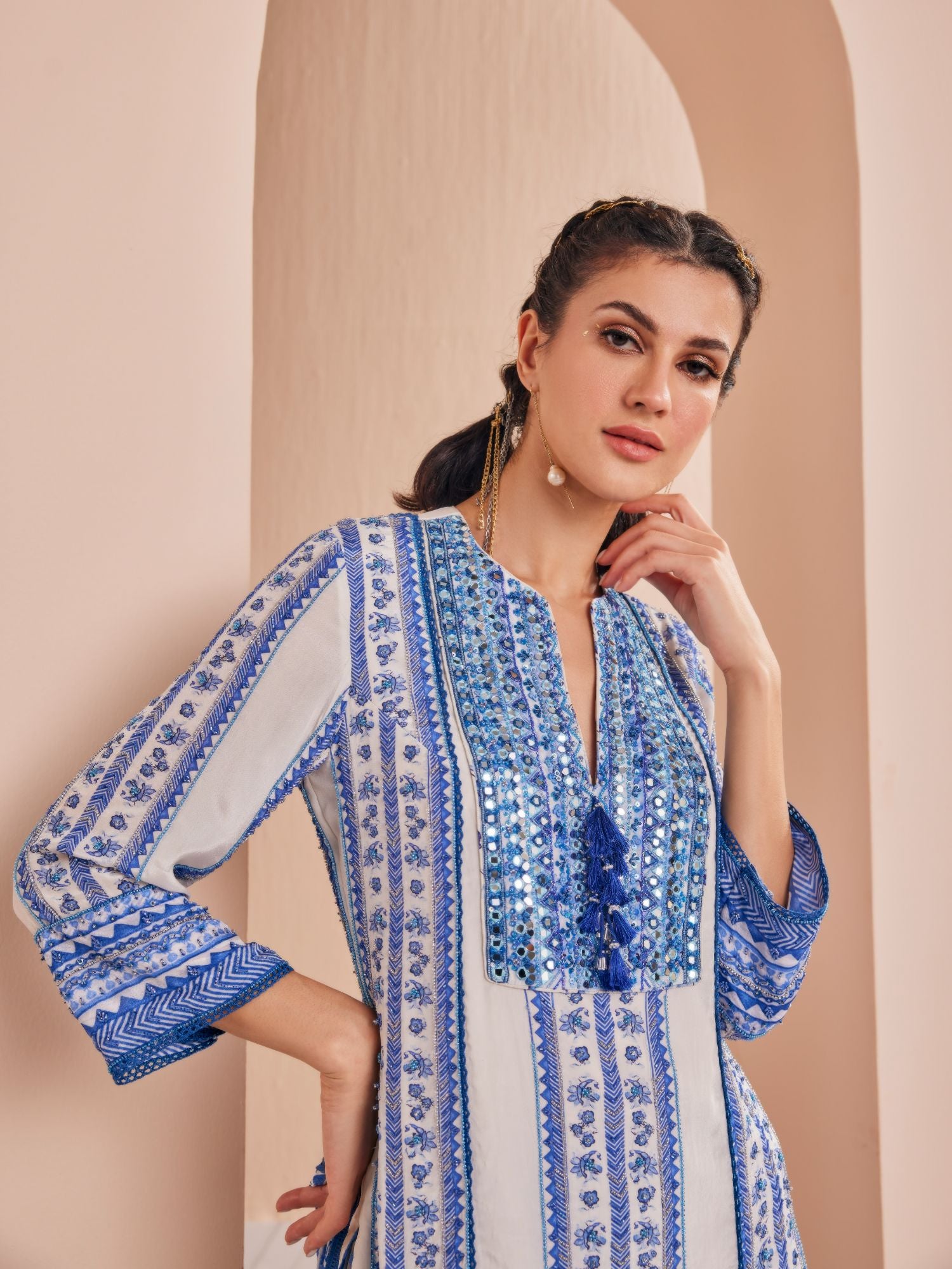 Blue perwinkle border kurta paired with tiered sharara and dupatta