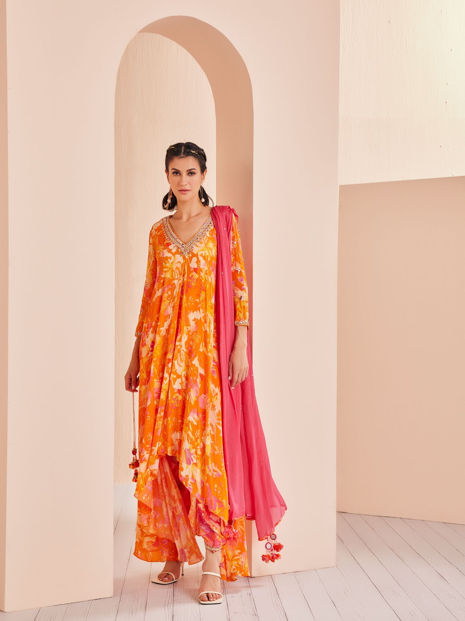 Printed crepe asymmetric embroidered tunic complimenting with dhoti and dupatta