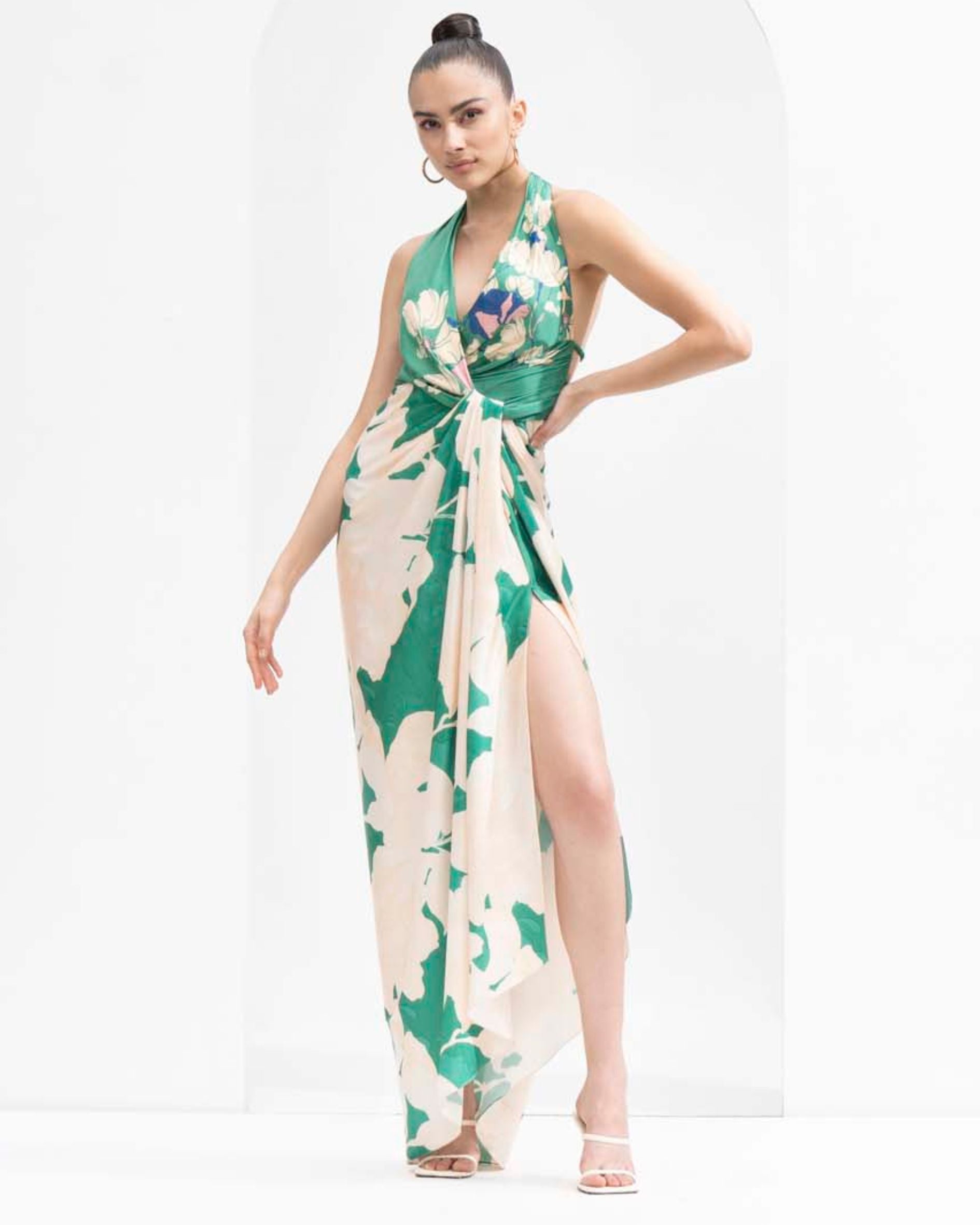 Mystic green placement printed draped halter neck dress made with lustrous satin.