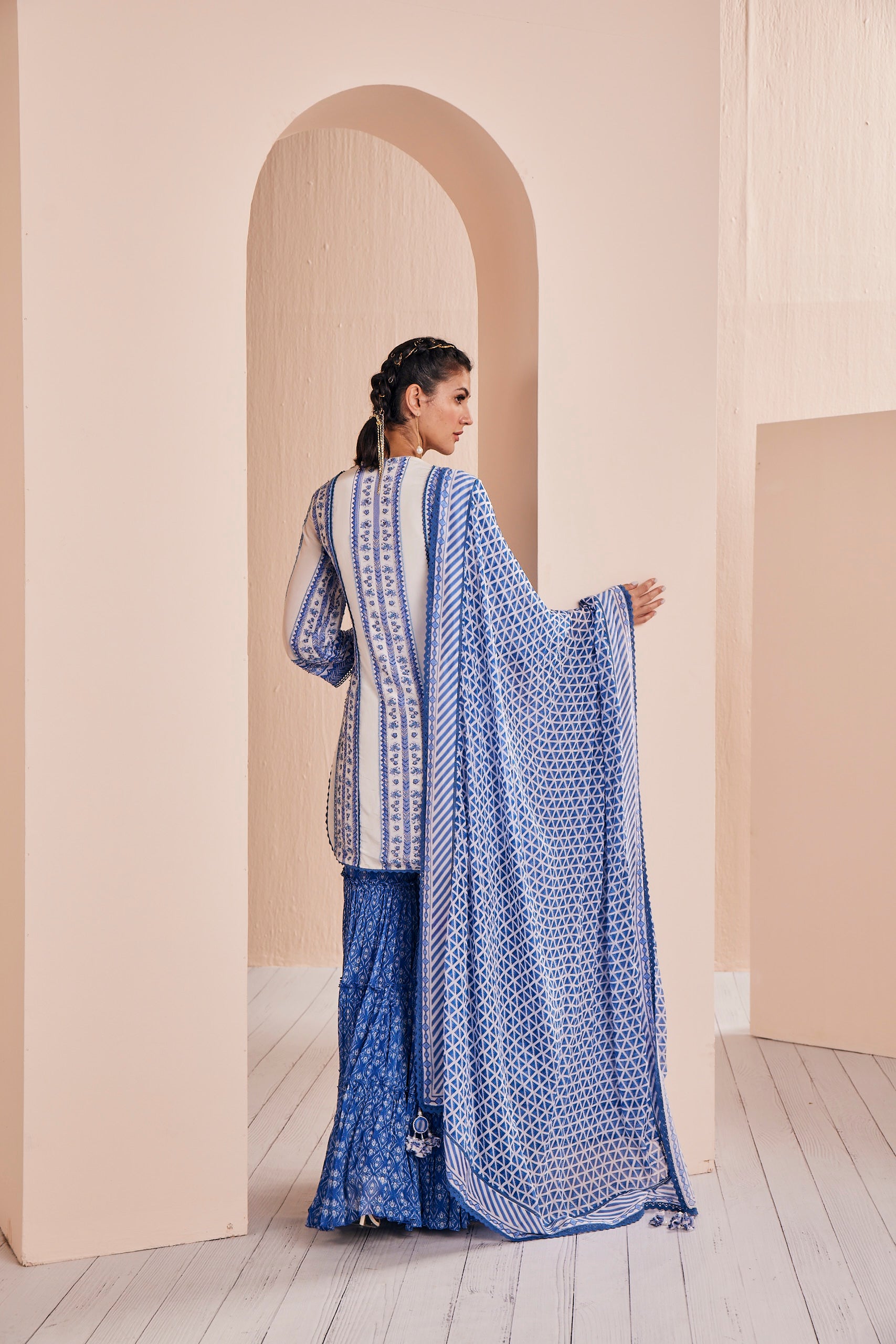 Blue perwinkle border kurta paired with tiered sharara and dupatta