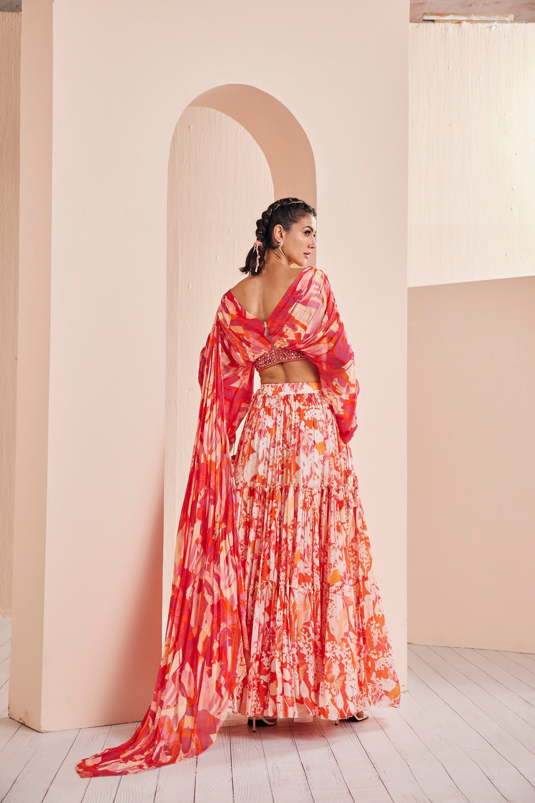 Printed chiffon tiered lehenga with stylized draped blouse detailed rushed sleeve