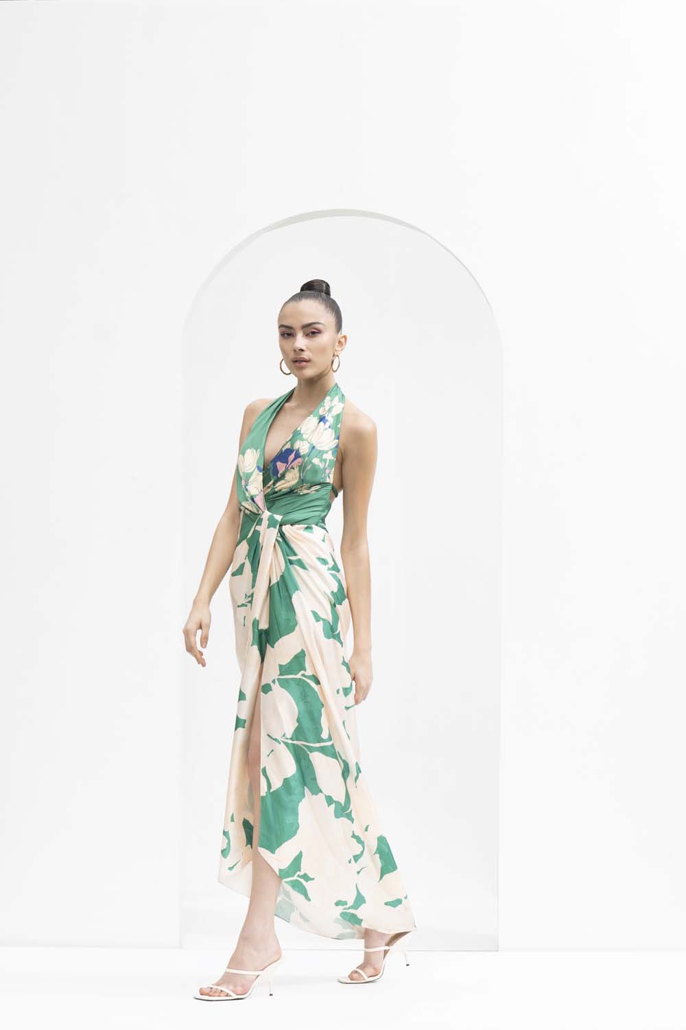 Mystic green placement printed draped halter neck dress made with lustrous satin.