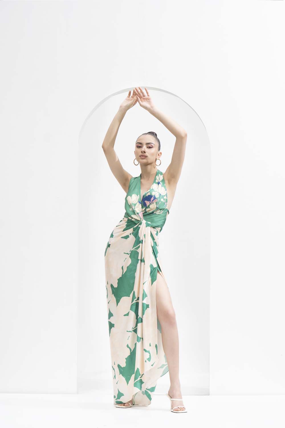 Mystic green placement printed draped halter neck dress made with lustrous satin.