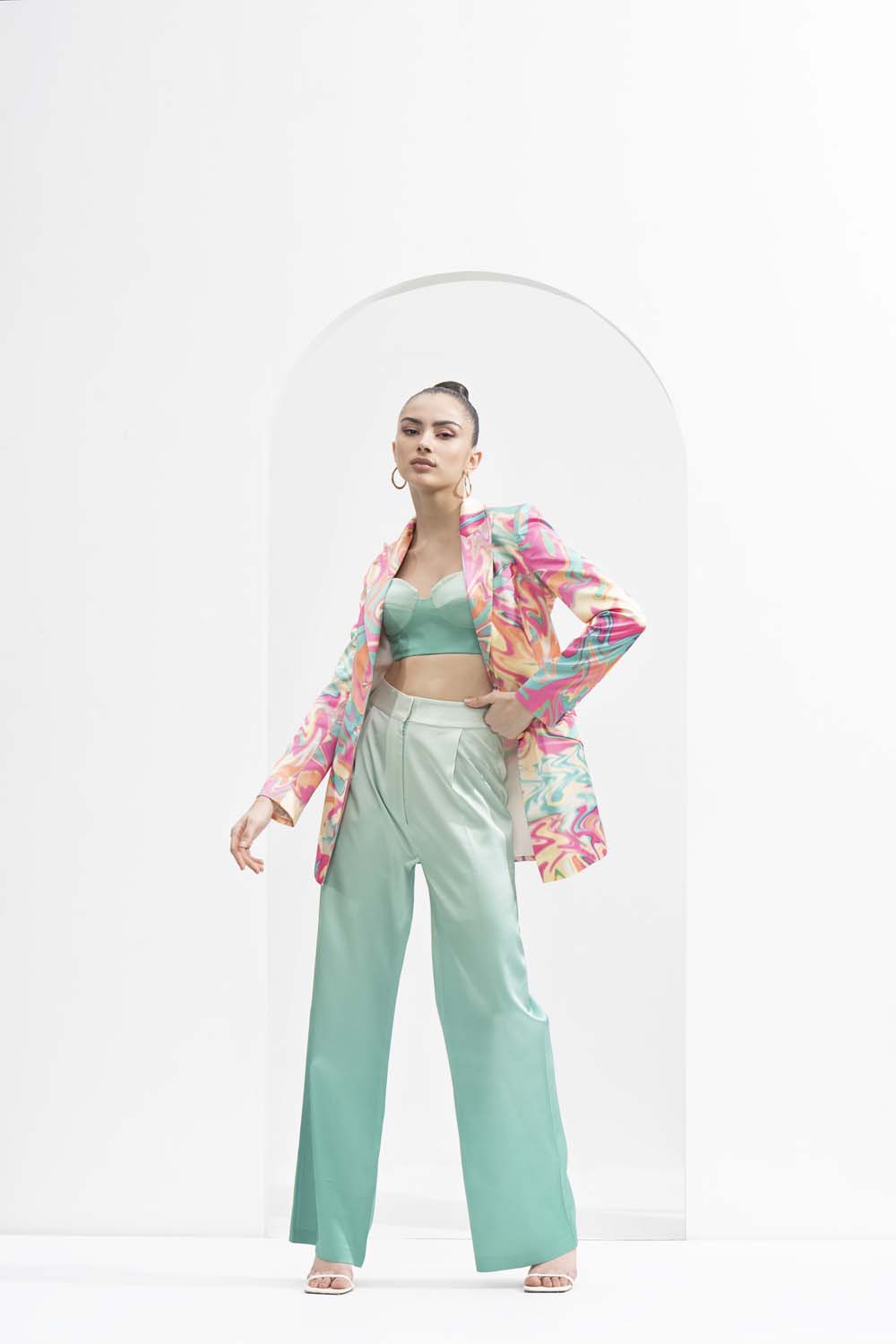 Blurred printed satin jacket, ombre printed corset bustier, and pants.