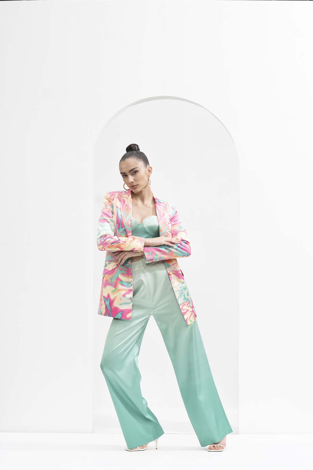 Blurred printed satin jacket, ombre printed corset bustier, and pants.