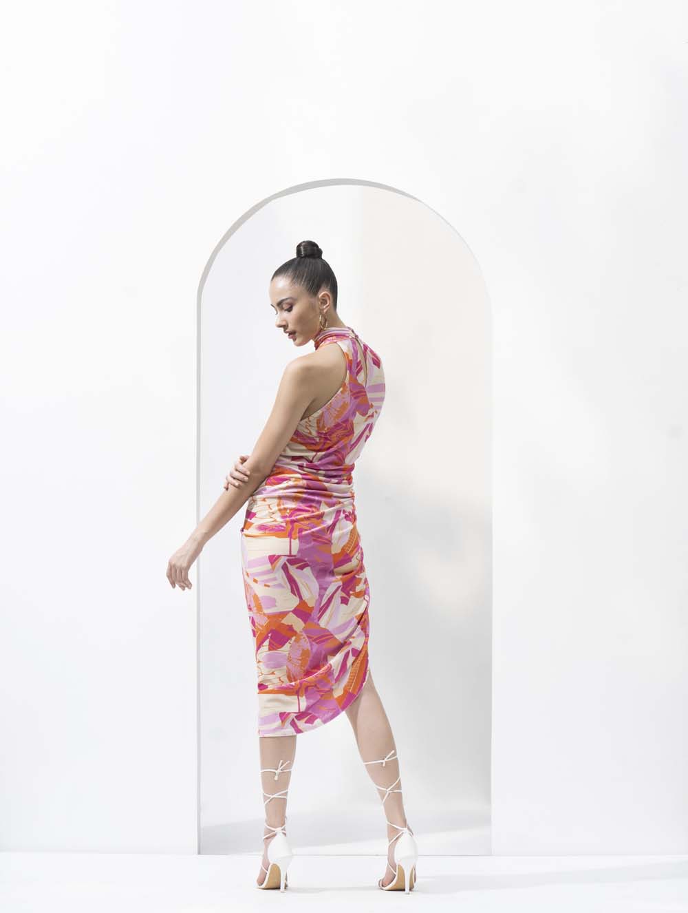 Pink abstract lycra velvet printed short dress with ruched detailing.