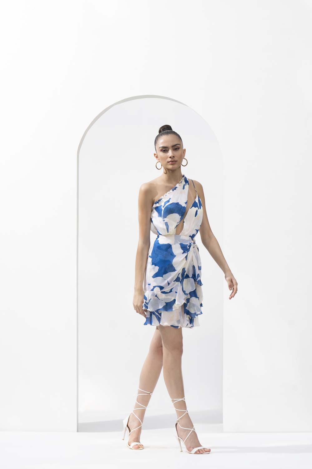 Mystic blue texture printed one-shoulder chiffon short dress with a gold accessory.