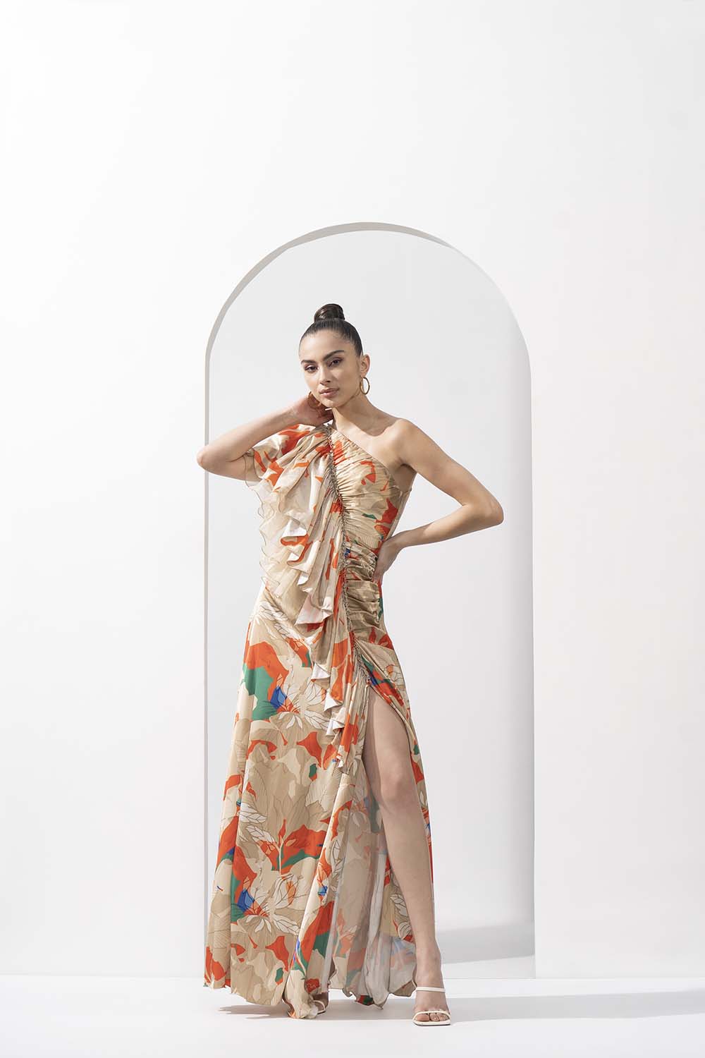 Mystic orange printed lustrous satin one-shoulder dress with solid organza frill detail.