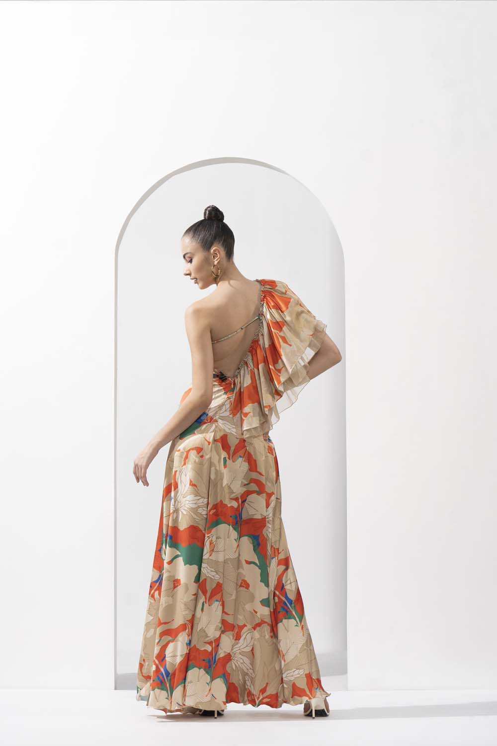 Mystic orange printed lustrous satin one-shoulder dress with solid organza frill detail.