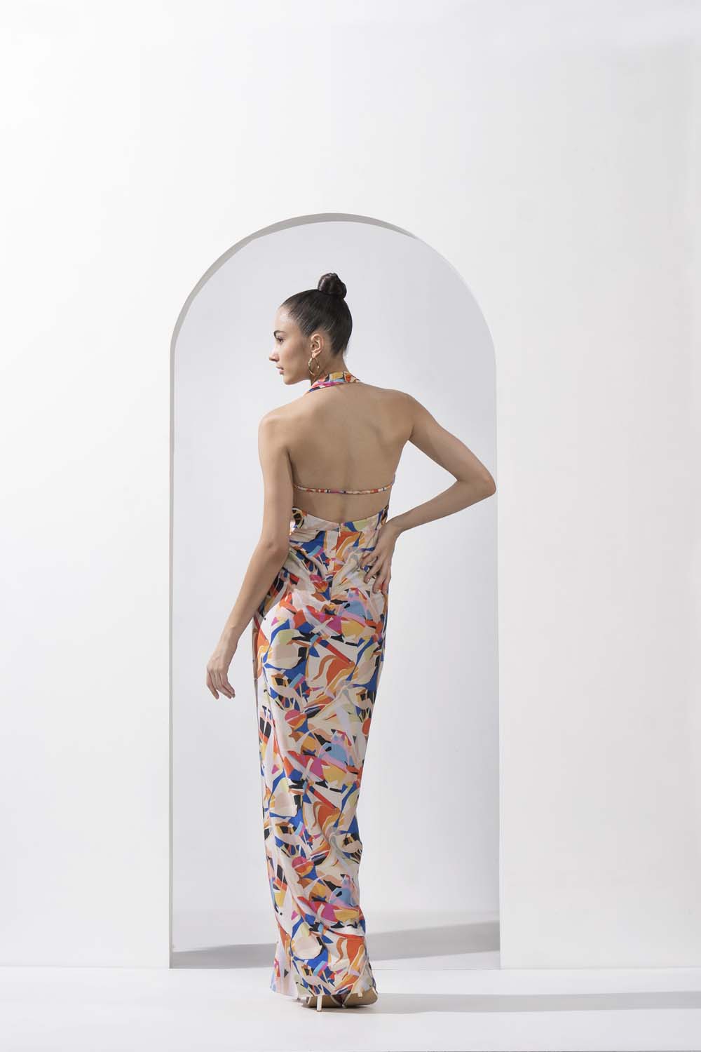 Abstract geo printed draped halter neck dress made with lustrous satin.