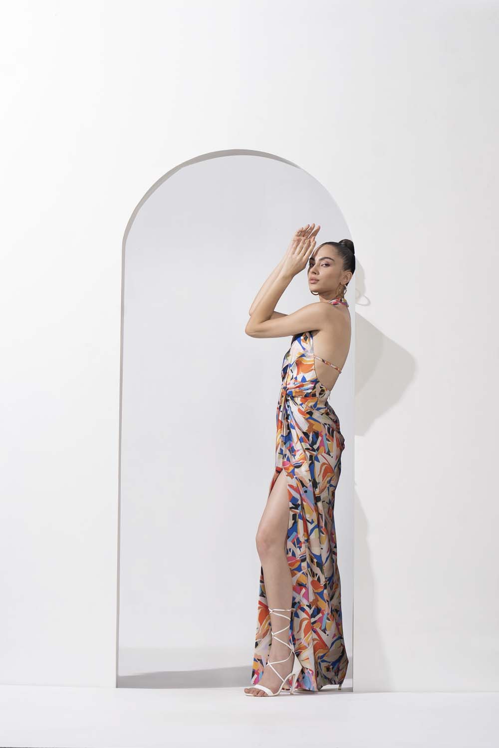 Abstract geo printed draped halter neck dress made with lustrous satin.