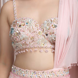 A Pastel Pink Drape Saree With A Hand Embroidered Blouse