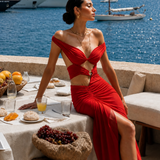 An off-shoulder gown constructed over a built-in bodysuit, 