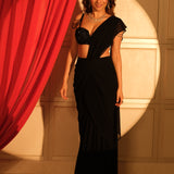 Black reception saree with sweetheart neckline embellished blouse