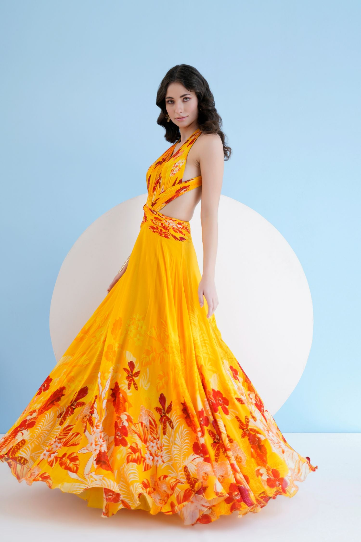 Orchid Yellow Printed Long Dress With Halter Neckline
And Waist Cutout