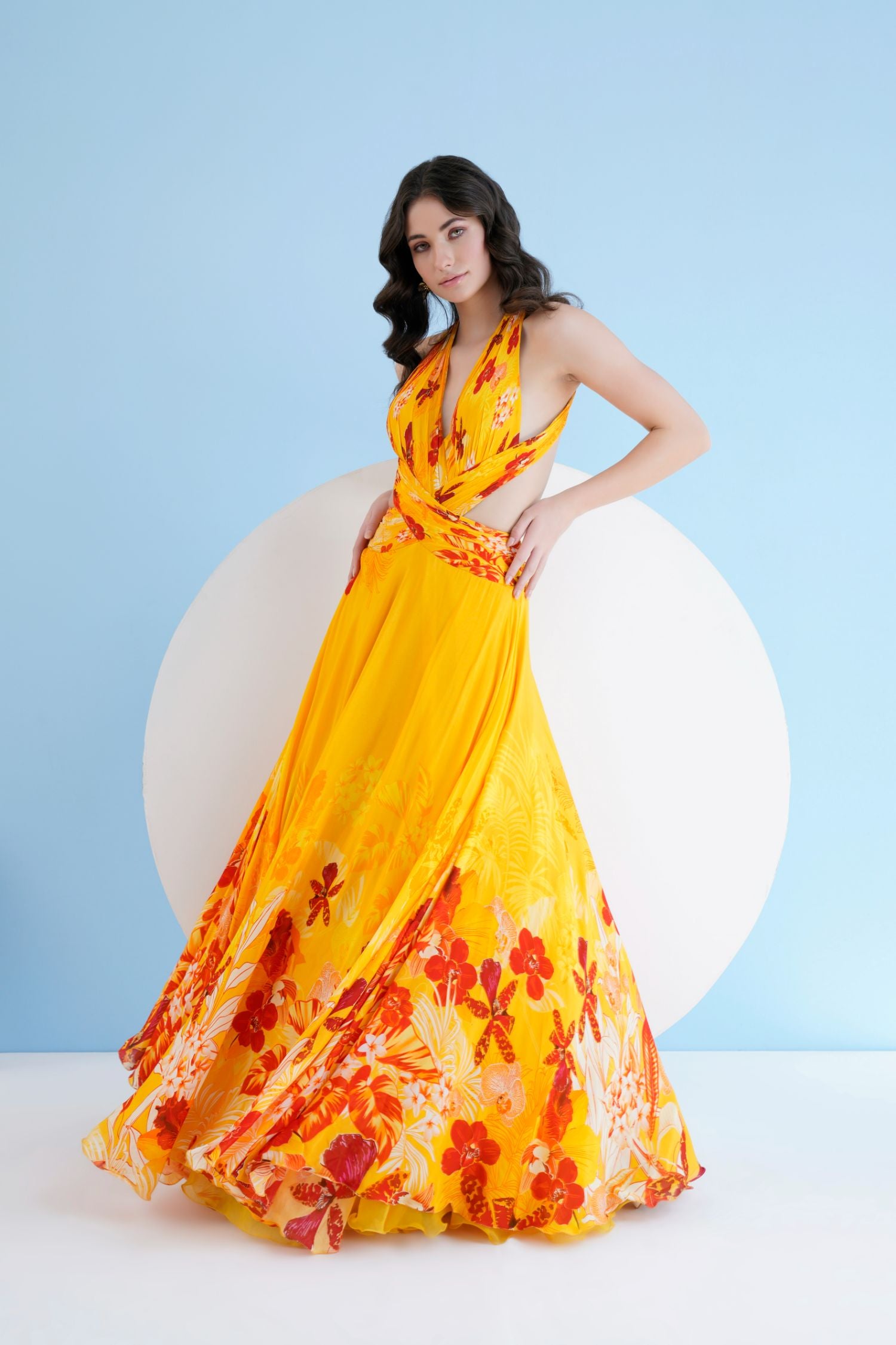 Orchid Yellow Printed Long Dress With Halter Neckline
And Waist Cutout