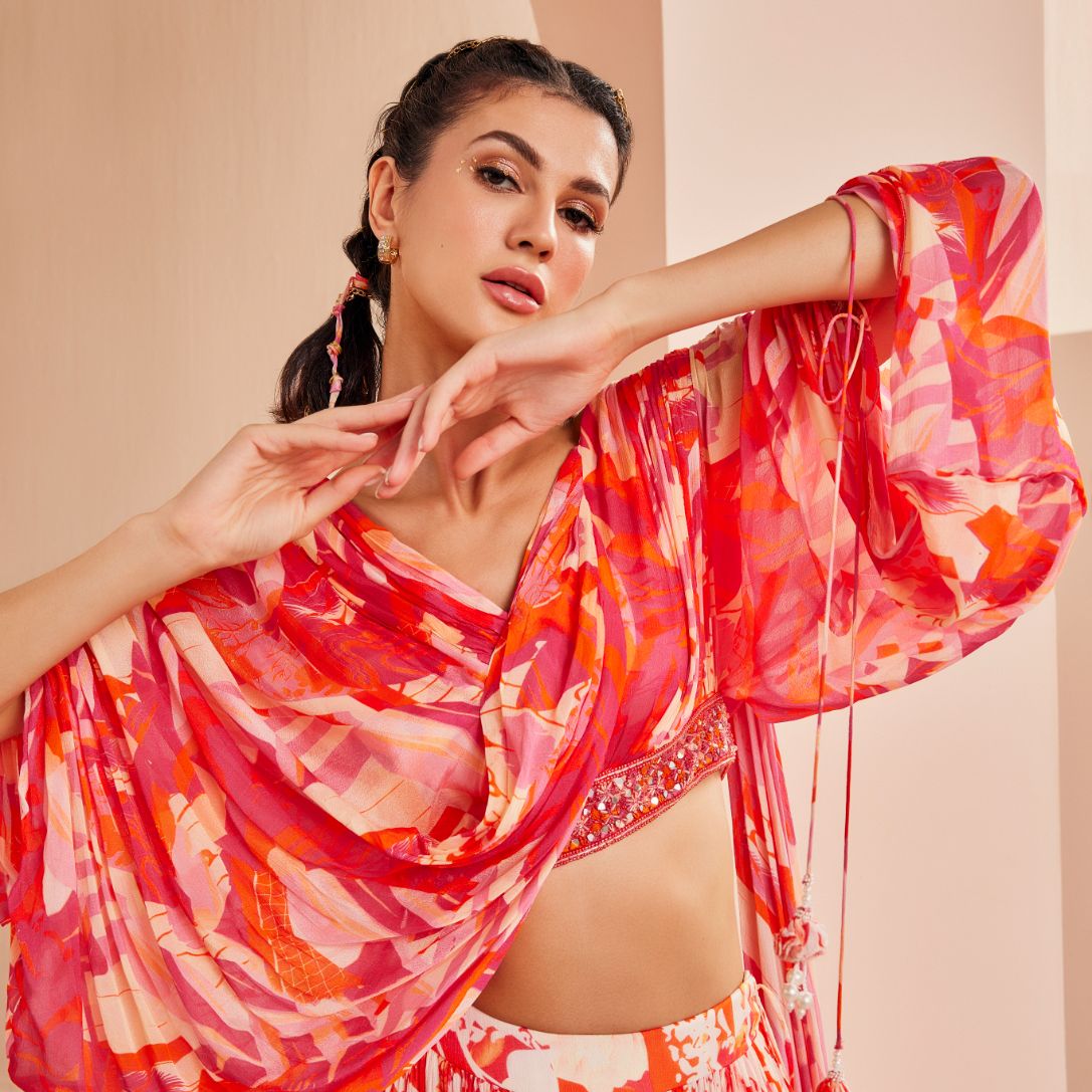 Printed chiffon tiered lehenga with stylized draped blouse detailed rushed sleeve