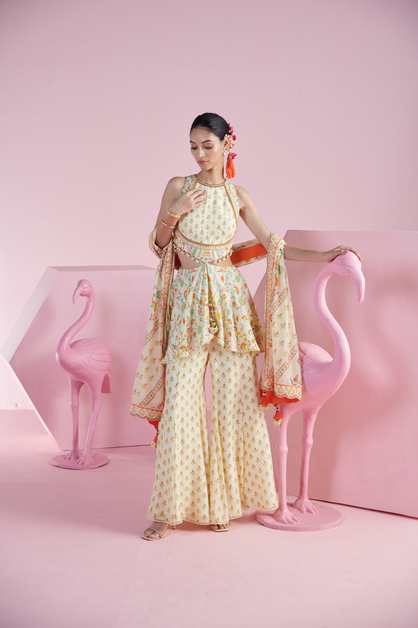 Lemon Zest Peplum Top with Cut-Out Details with Tassels, along with  Printed Sharara, and Dupatta