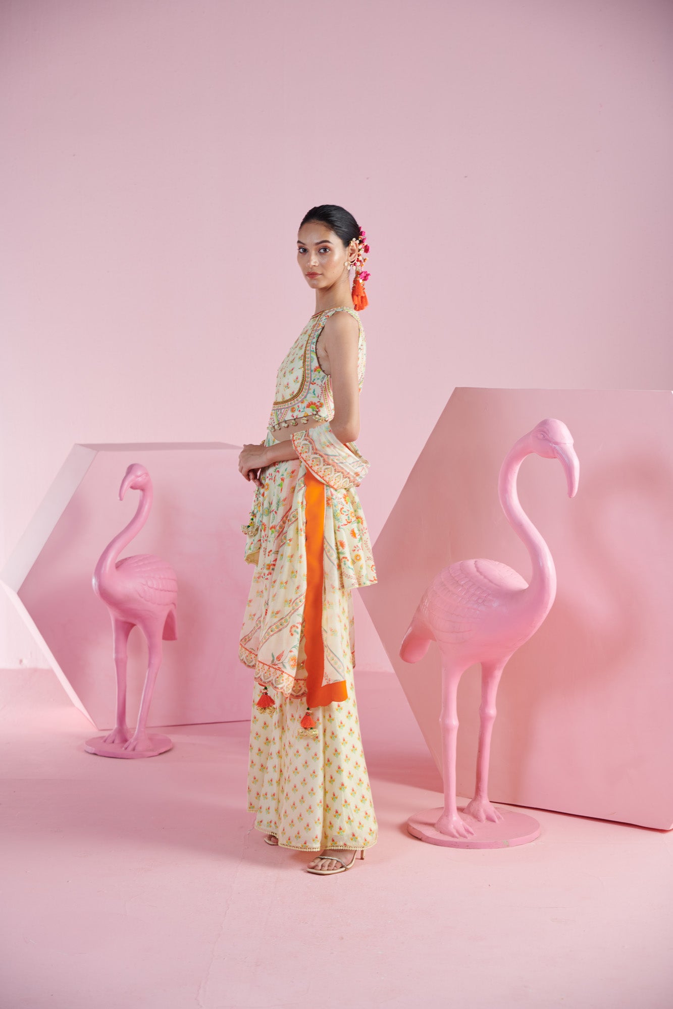 Lemon Zest Peplum Top with Cut-Out Details with Tassels, along with  Printed Sharara, and Dupatta