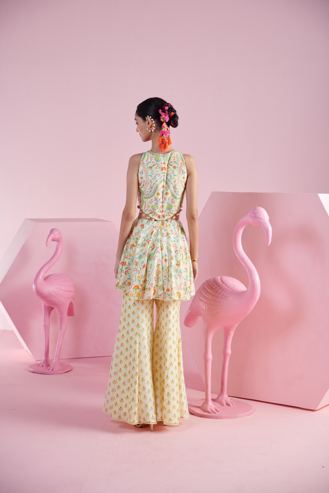 Lemon Zest Peplum Top with Cut-Out Details with Tassels, along with  Printed Sharara, and Dupatta