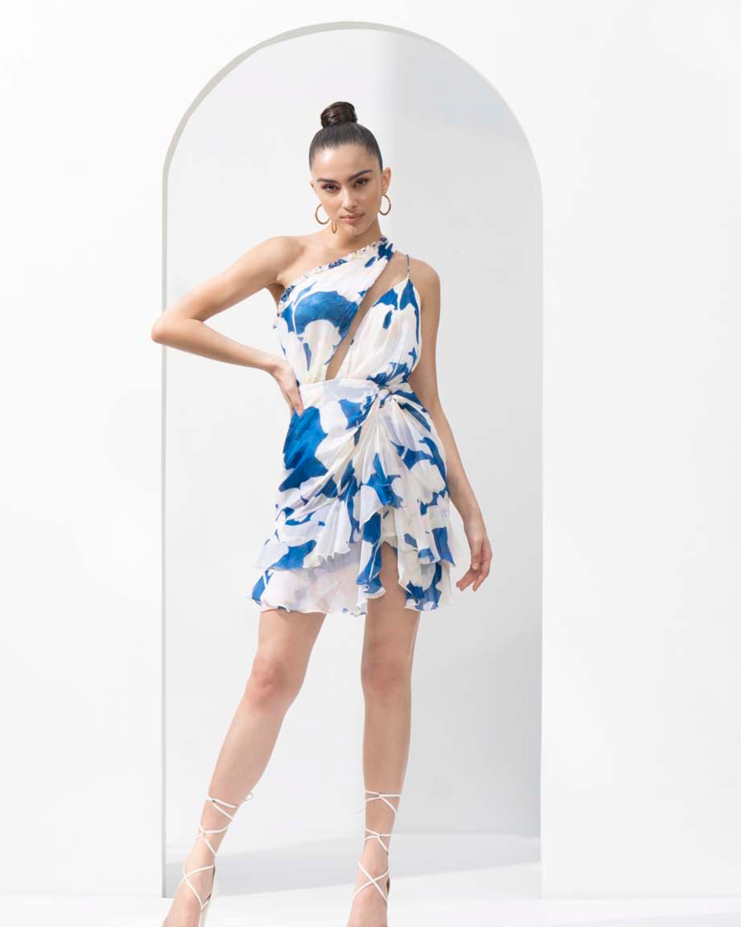 Mystic blue texture printed one-shoulder chiffon short dress with a gold accessory.