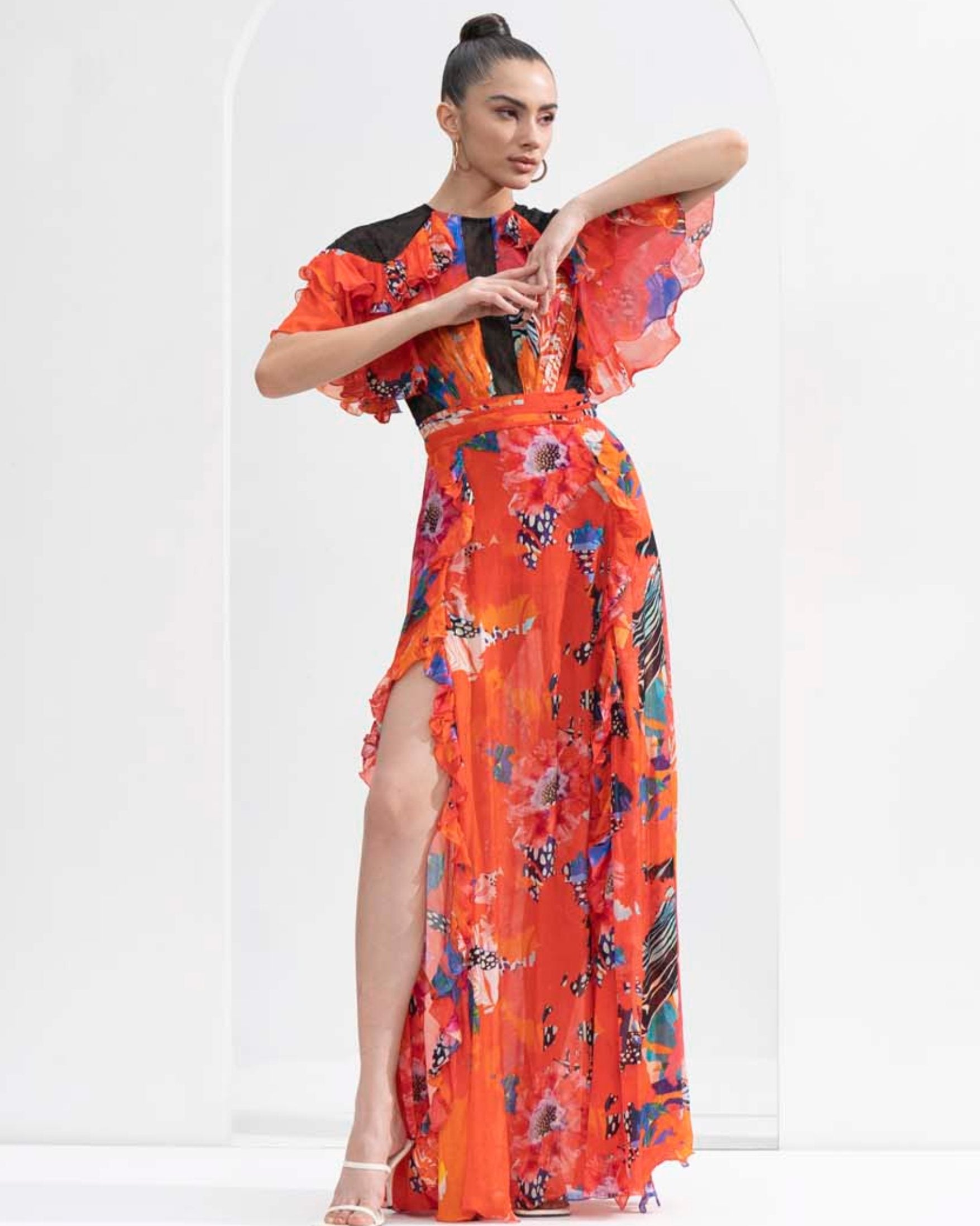Red garden printed chiffon dress with a slit on both sides and Chantley detailing on the bodice.