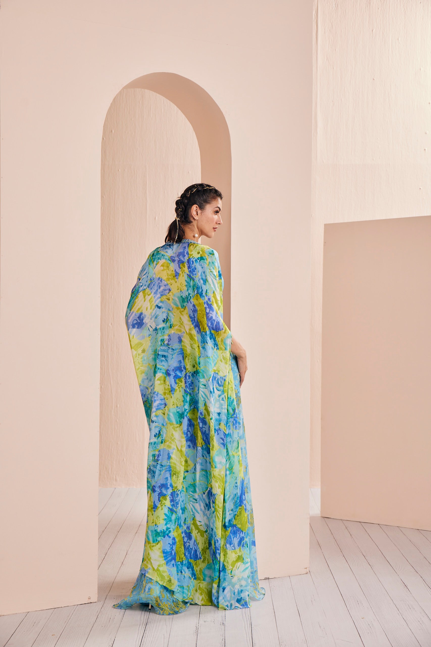 Printed chiffon embroidered blouse paired with paneled sharara, fully embroidered belt and cape