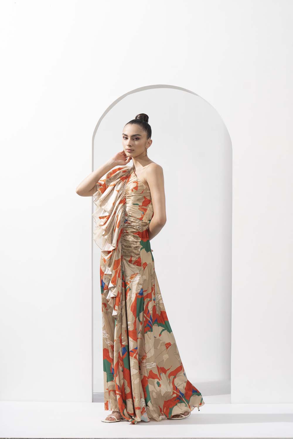 Mystic orange printed lustrous satin one-shoulder dress with solid organza frill detail.