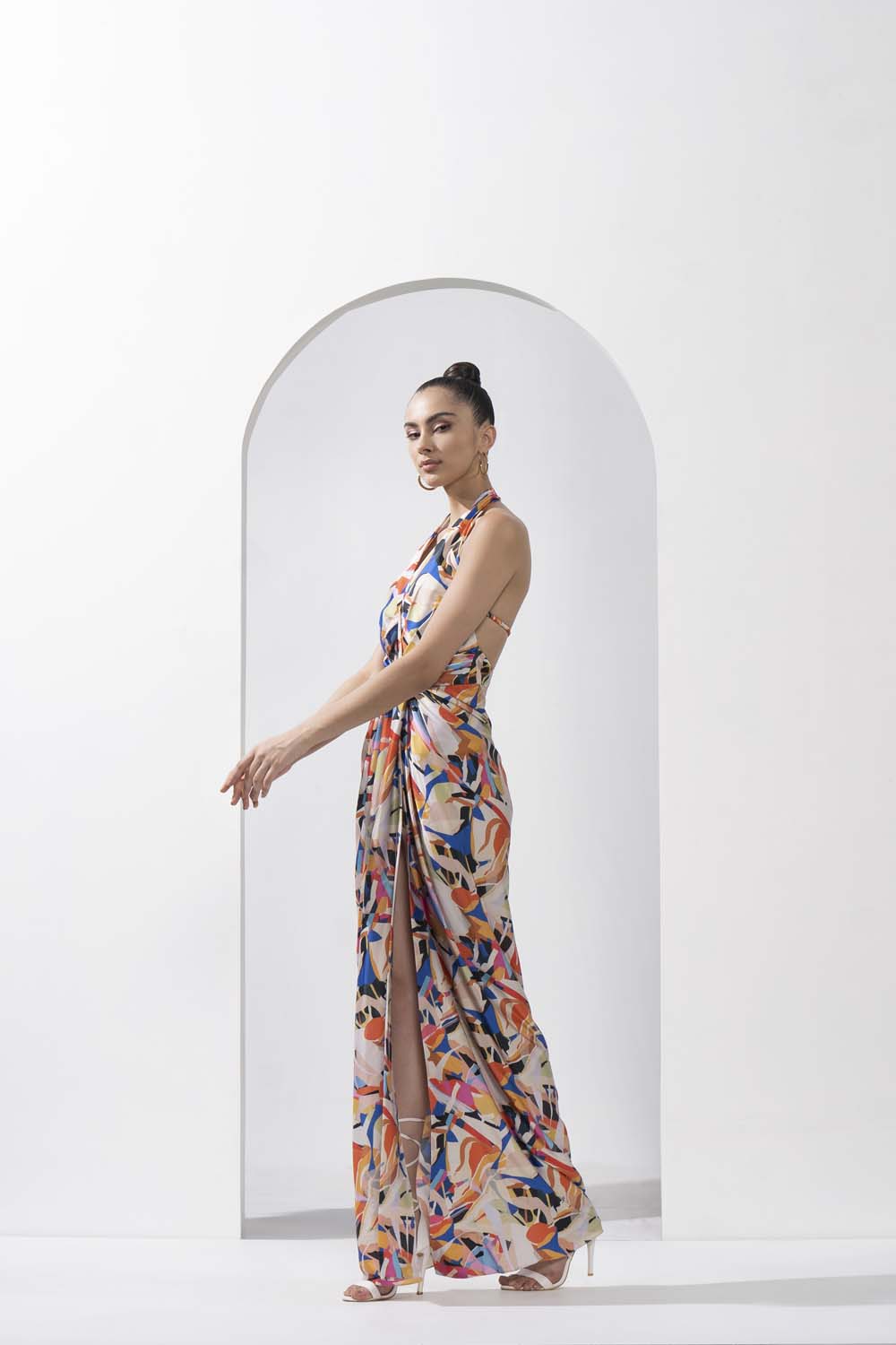 Abstract geo printed draped halter neck dress made with lustrous satin.