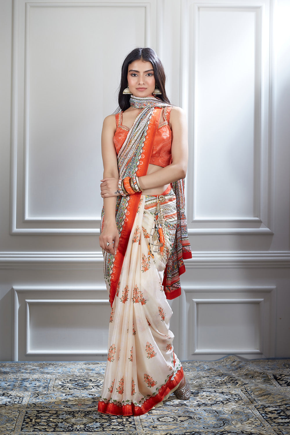 A printed saree paired with a hand embroidered printed blouse
