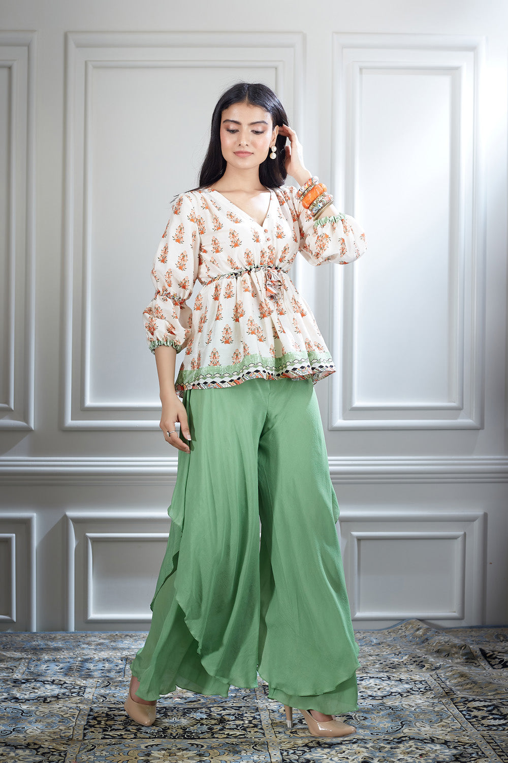 A printed ivory peasant top paired with a double-layer bias sharara.