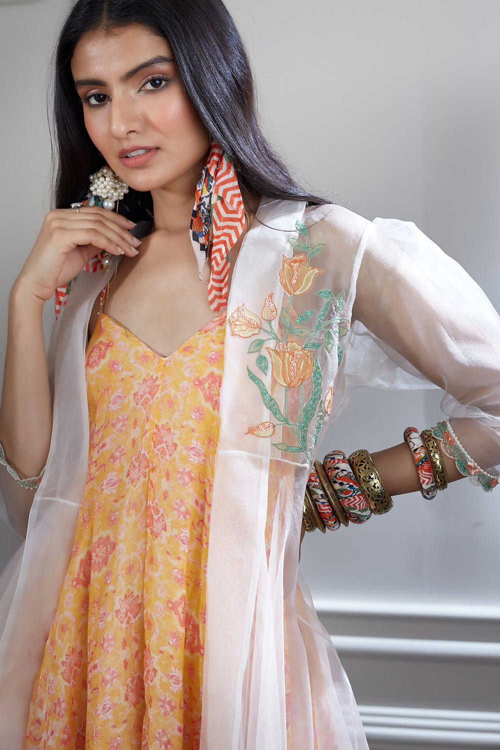 A printed chiffon bias dress paired with an embroidered  organza long bias jacket